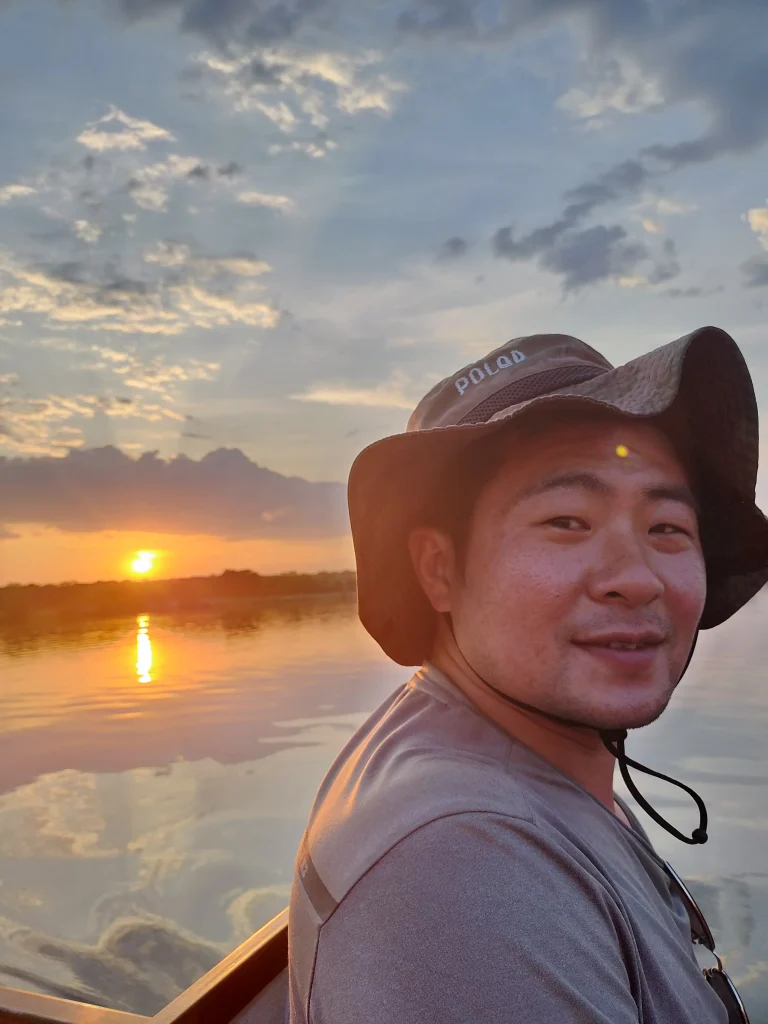 sunset time on africa zambezi river on the boat relected sun